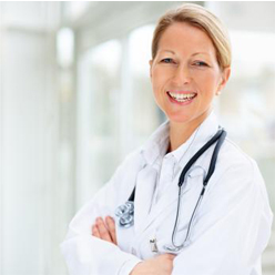 Portrait of a happy successful mature female doctor with hands folded